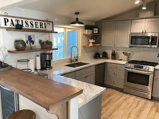 remodeled kitchen with marble counters