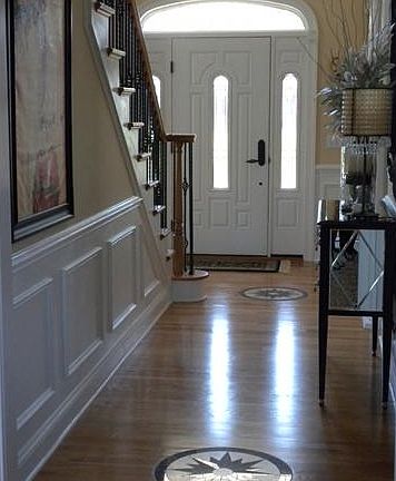 Stunning hardwood foyer with marble inlays