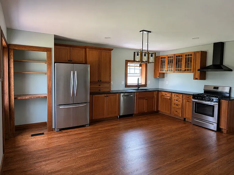 Kitchen with gas stove, dishwasher, area for coffee bar
