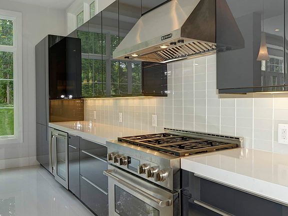 Pro-grade range under a vented steel hood