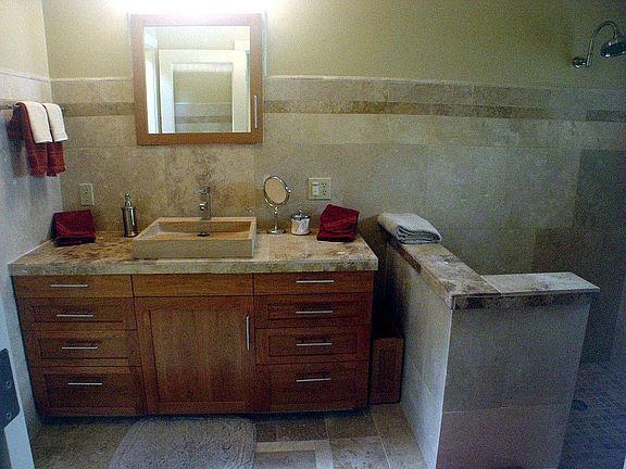 Tavertine Tile baths Open shower.