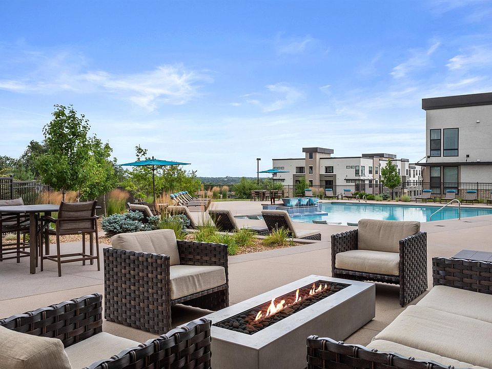Outdoor Lounge with Fire Pit and Comfortable Seating Areas