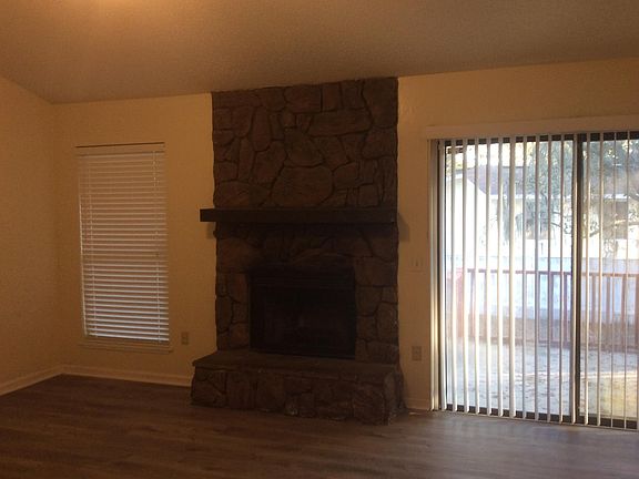 Living room with wood burning fireplace
