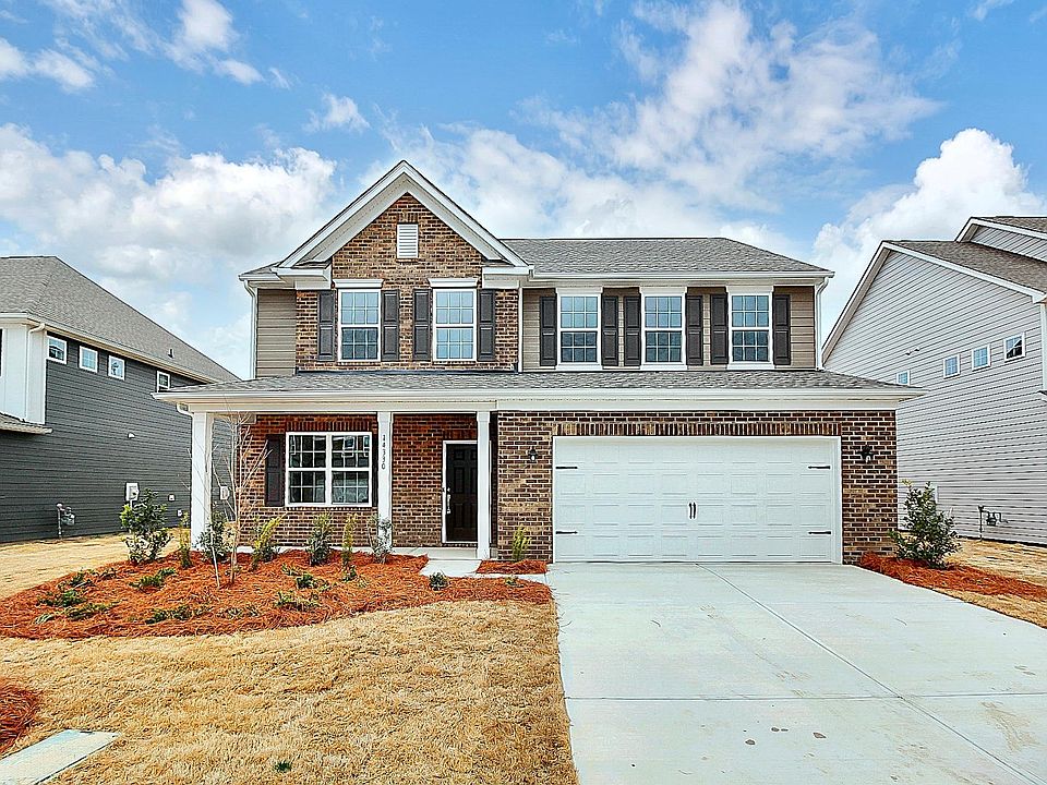 Front of home with brick accents
