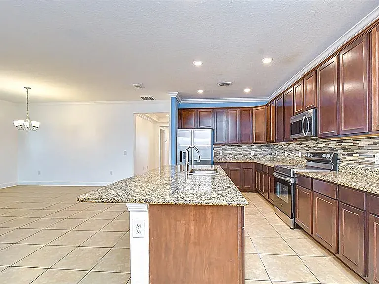Note: Kitchen accent wall has since been professionally repainted to match the updated interior color scheme. Updated photos coming soon.