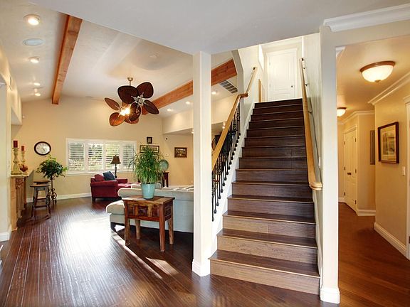 Family room and stairway leading up to 4 bedrooms with Jack & Jill baths