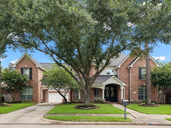 Traditional brick elevation incredible home with 5 spacious bedrooms, 3.5 bathrooms and a 3 car garage with porte-choche surrounded by beautiful established shade trees and mature landscaping.