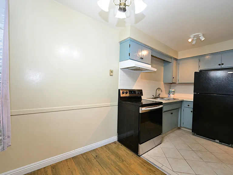 Updated kitchen with quartz countertop, SS appliances.