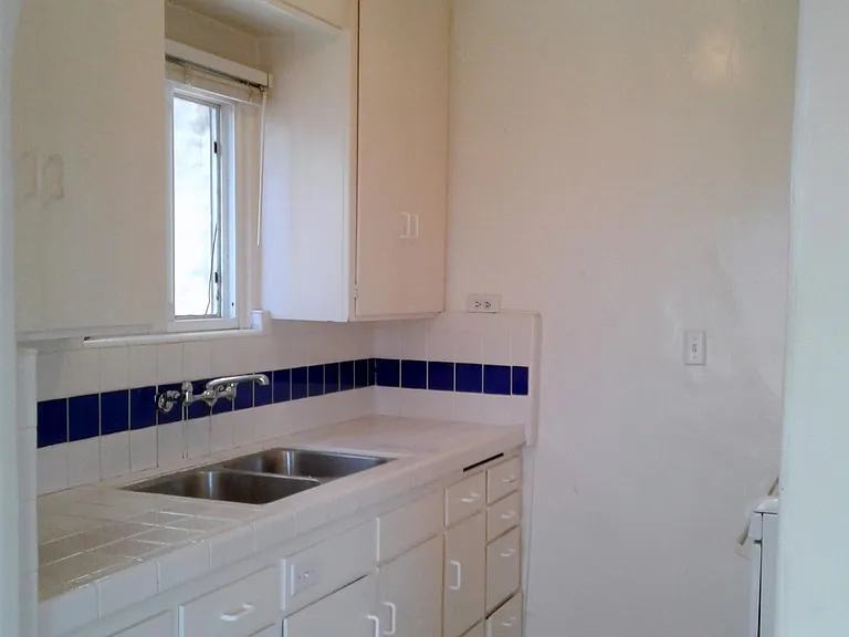 Kitchen "All White" with Dark Blue tile accent on backsplash