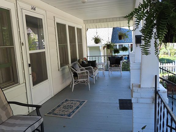Front porch is furnished with comfortable seating.