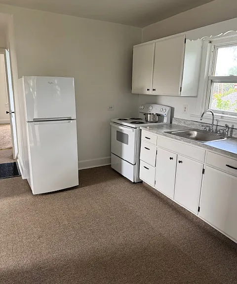Kitchen, with new Electric range and refrigerator.