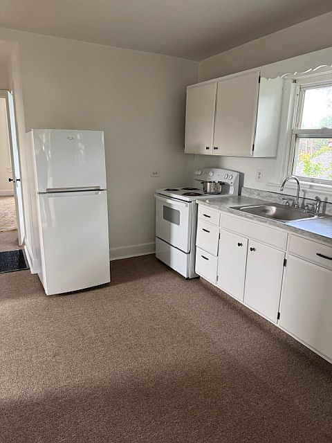 Kitchen, with new Electric range and refrigerator.