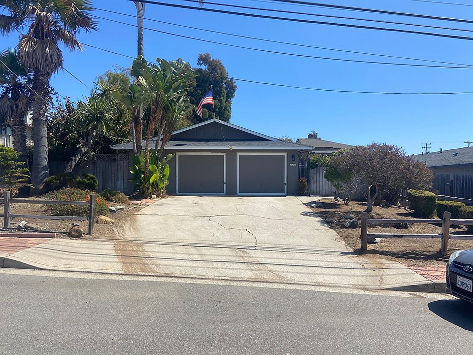 Front of duplex (left side is designated parking in driveway)