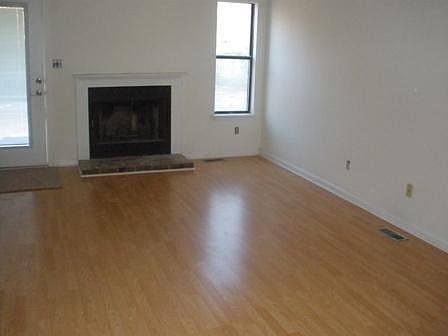 Living Room w/ wood burning fireplace