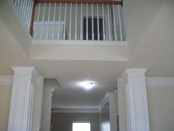 Grand two story foyer with overlook