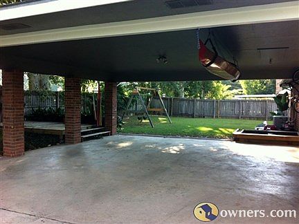 Carport, Sandbox, and Back Yardd