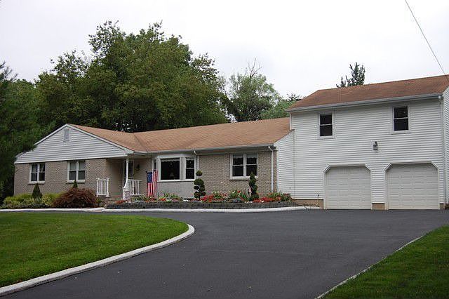 Oversized ranch with bonus room,full bath and closet over garage