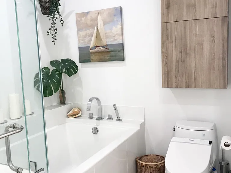 Deluxe "washlet" toilet with bidet, seat warmers, and programmable wireless control functions.