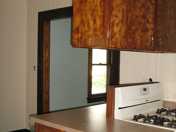 Kitchen has stove and refrigerator