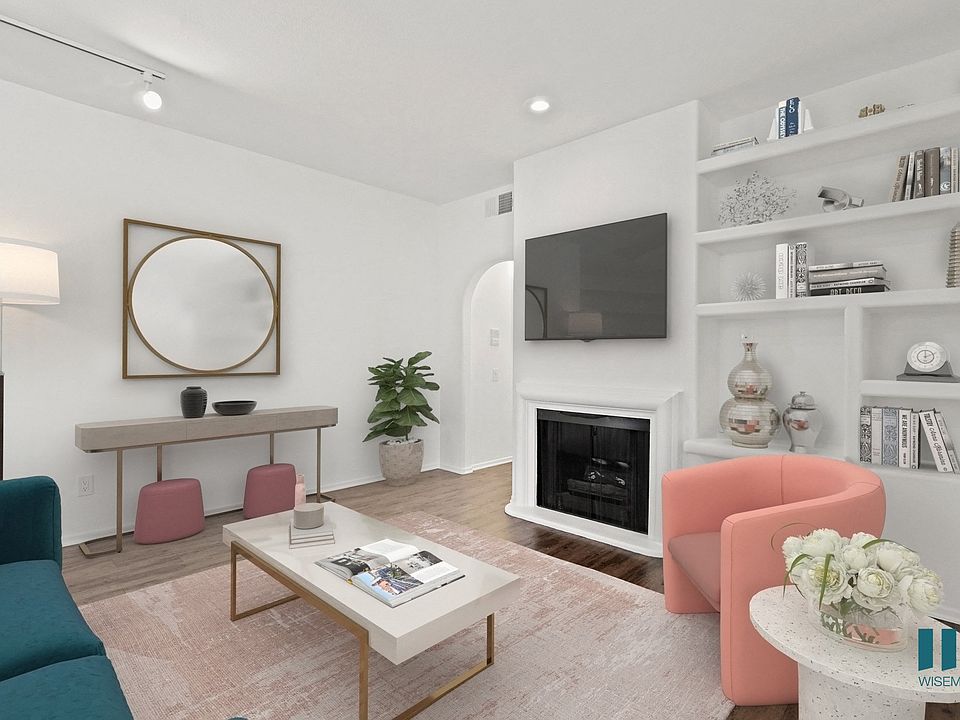 Living Room with Built-In Shelving, Vinyl Flooring, and Recessed Lighting