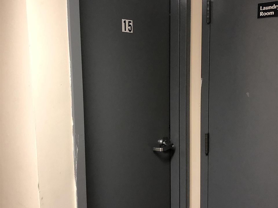 Door to your unit located on the opposite side of the hall after entering the main entrance