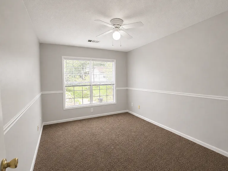 Clean and modern duplex featuring central AC, updated LVP flooring, fresh neutral paint, large living spaces, refrigerator, oven, and a bright move-in-ready interior in Phenix City, AL.