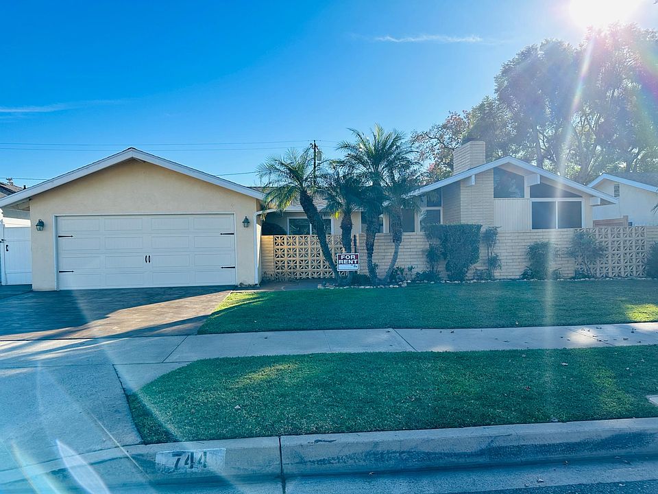 Updated garage door and stained driveway