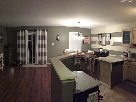 View from hall into kitchen and dining area