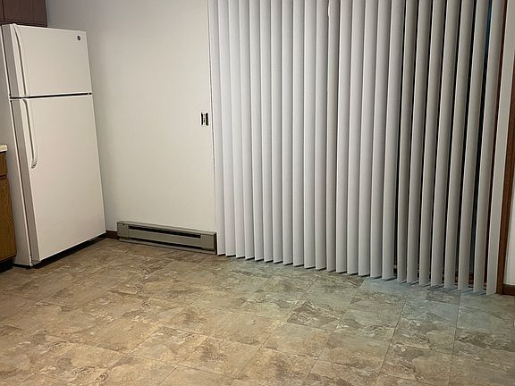Kitchen with patio doors to patio and large yard.