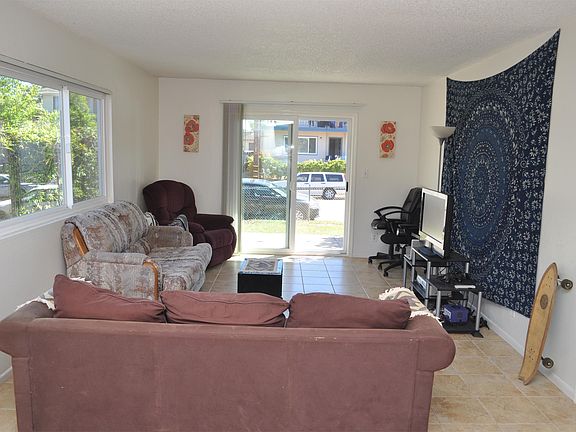 View of living room from kitchen, new tile floors