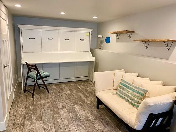 Murphy bed converts to a desk when not in use.