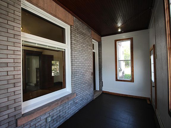 Enclosed front porch.