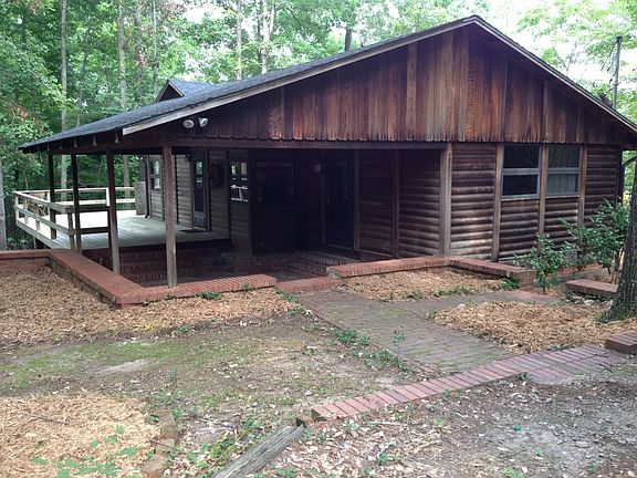 Front of house - Sunk brick patio, wrap around porch