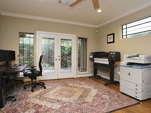 Study/ 2nd Bedroom:
Just off the foyer to the right is the Study or Third bedroom. On the first floor and featuring a private bath, closet and double door access to the patio out back, this room can be multi-functional.