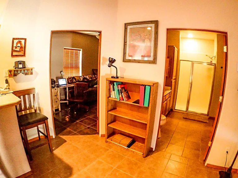 entry to bathroom and office/den