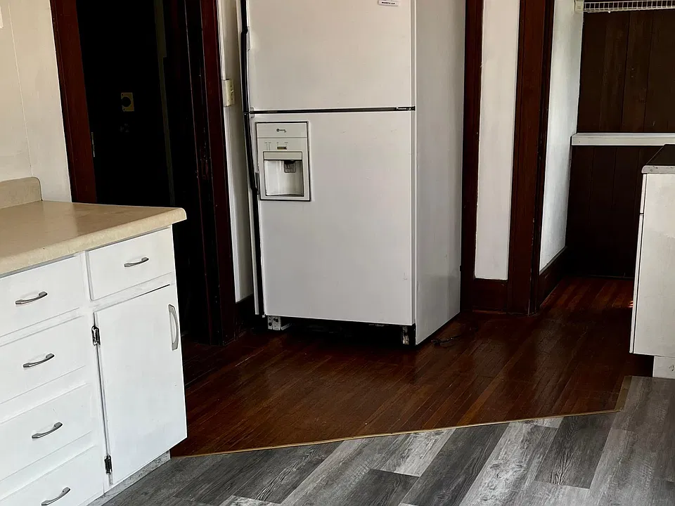 Large fridge and walk in pantry. Some original hardwood floors.