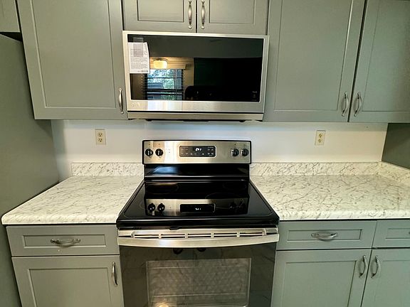 fully renovated kitchen with new cabinets and new appliances