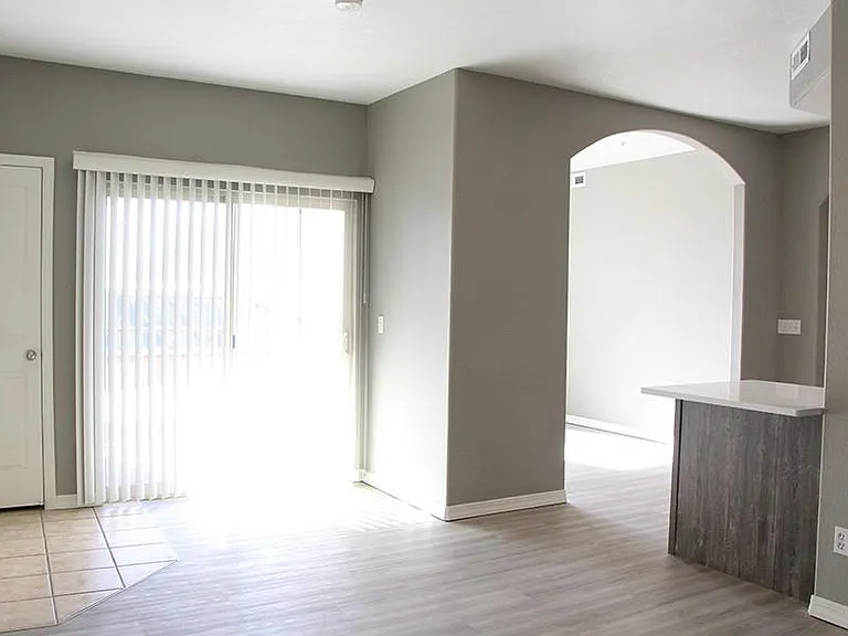 Renovated living room and dining room arched entryway.