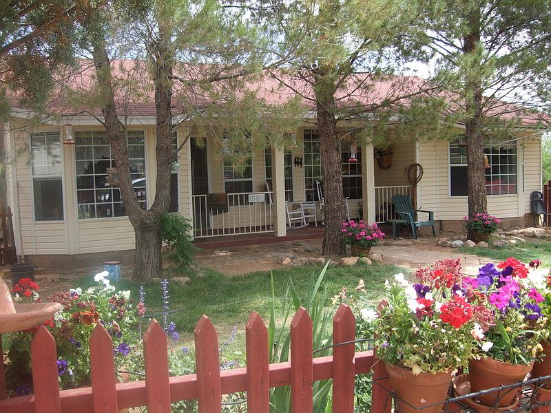 Front Yard : Beautiful front yard has charming picket fence and beautiful flowers.
