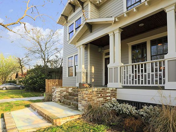Square columns, exposed rafter tails, big porch and beautiful brick steps welcome you to this home b