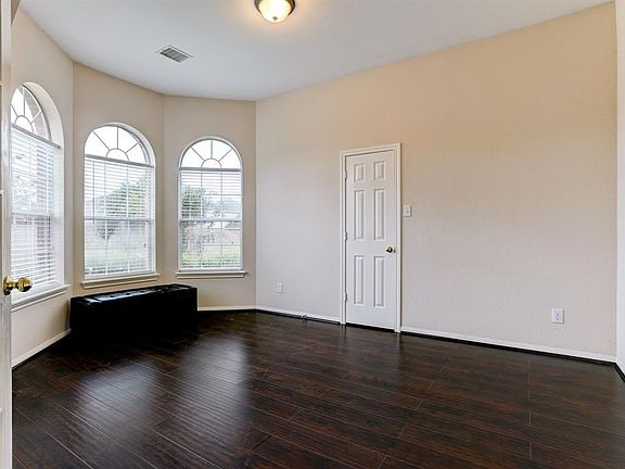 Facing the front yard you will find abundant natural lighting flooding this room; which can be used as a den/study or a bedroom.