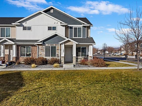 End unit with extra parking next to garage