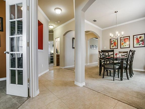 Arched openings frame this formal dining room