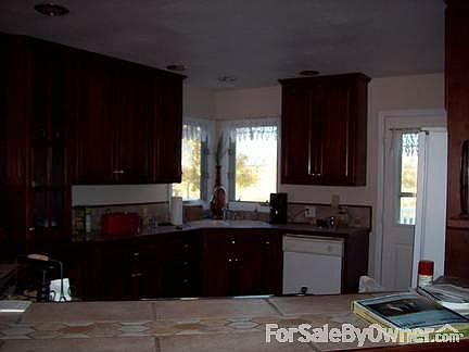 Kitchen with Pantry : 10.5 x 12, Cherry Wood Cabinets, tile floor and counters