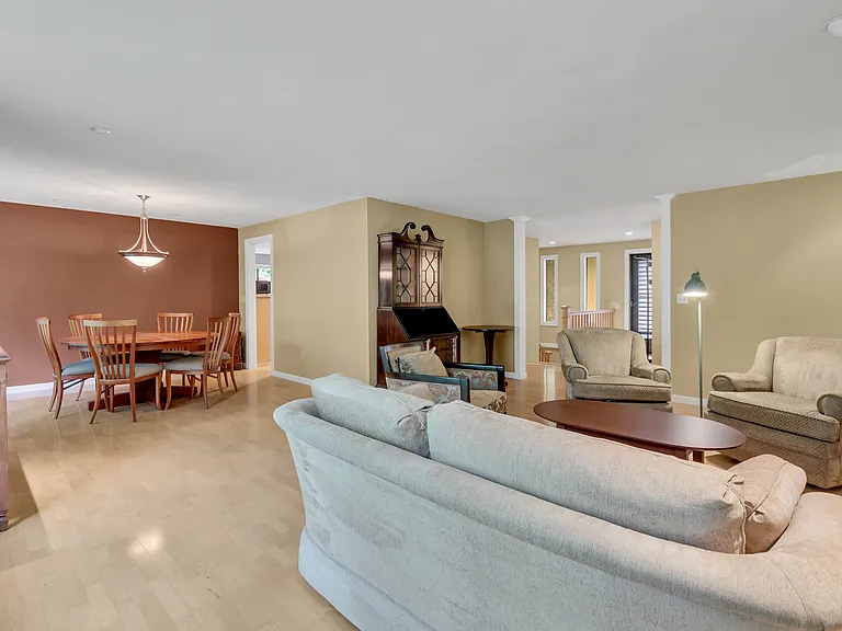 Dining, formal living, entry door with stairs to lower level.