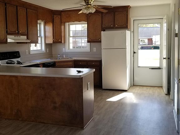 Large island separates kitchen and dining/living area.