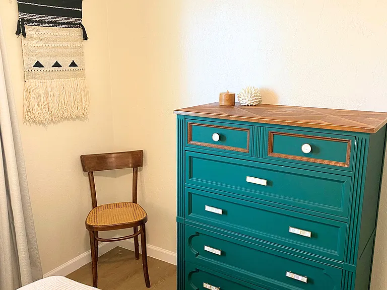 Bedroom 2 with dresser and chair