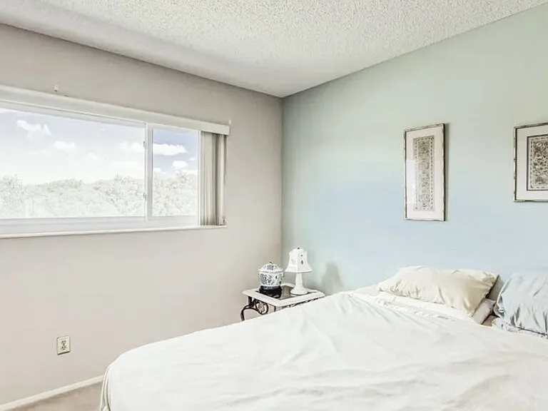 Master bedroom comes with two large closets, master bathroom, ceiling fan, and golf course view. The walls in this room have been recently painted to light gray. 

*This unit is unfurnished. All furniture has been removed.