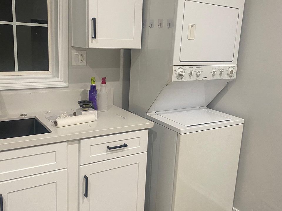 Washer and Dryer
New Custom Shaker Cabinets and Quarts Countertops.