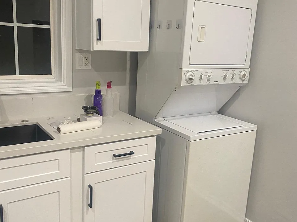 Washer and Dryer
New Custom Shaker Cabinets and Quarts Countertops.